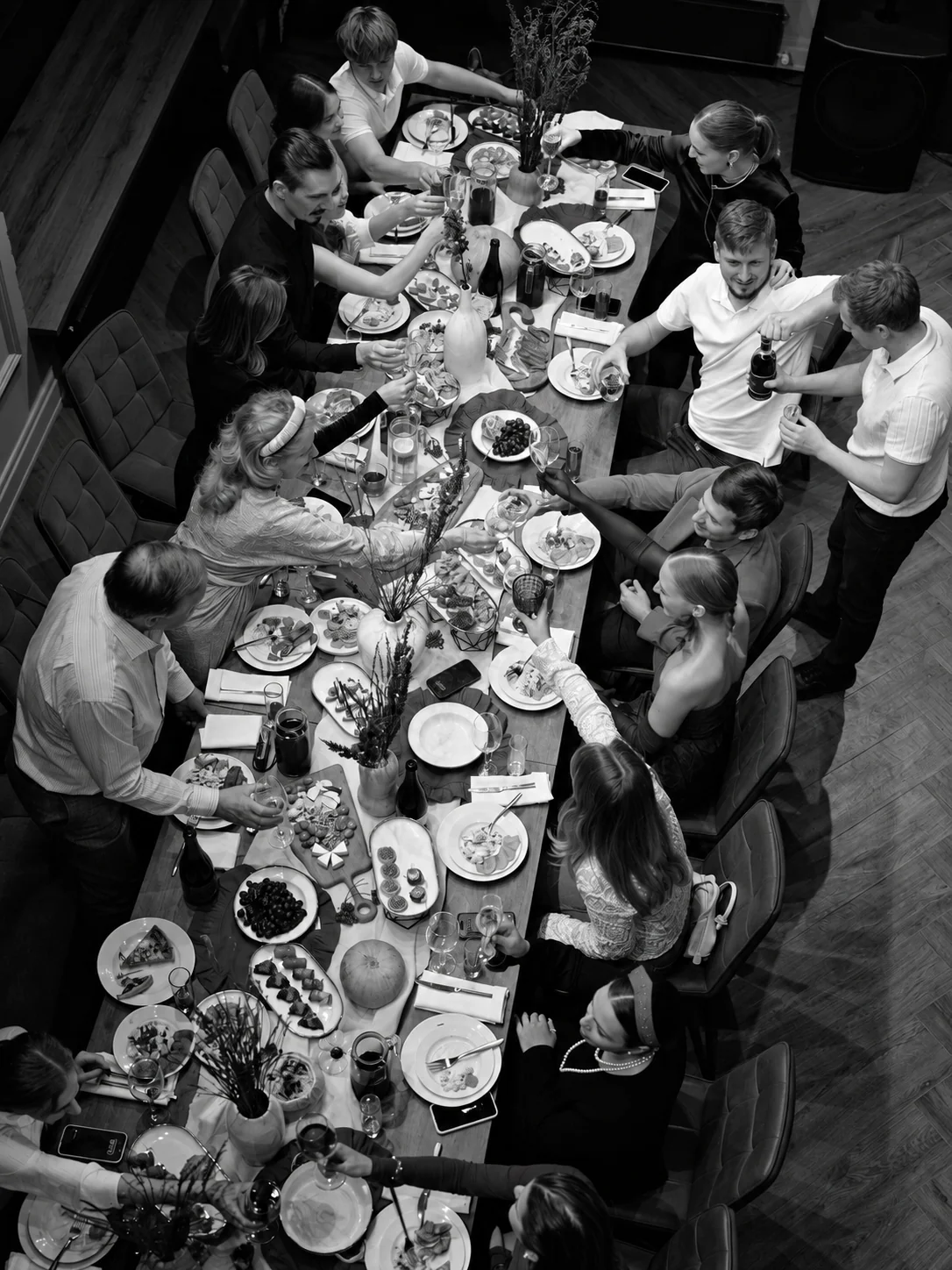 Black-and-white view of a restaurant team in motion during service